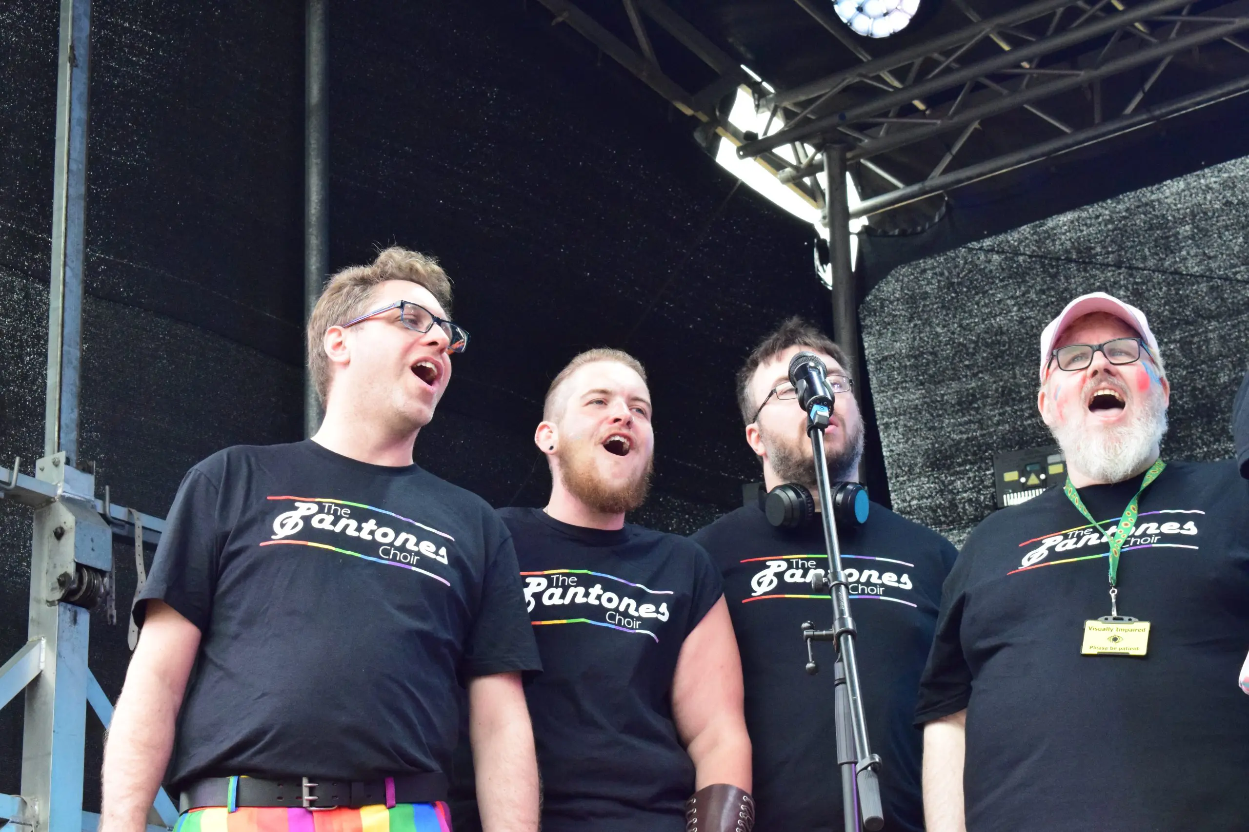 4 men singing.